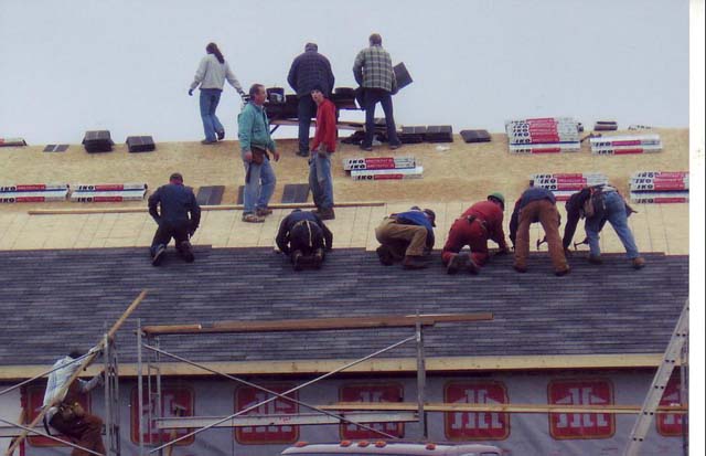 St. Andrews community volunteers install a roof on a community facility. 